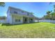 House with large backyard, green lawn and fence at 5103 Ashcrest Ct, Tampa, FL 33647