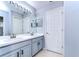 Bathroom with double vanity and updated fixtures at 5103 Ashcrest Ct, Tampa, FL 33647