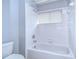 Bathroom with a shower/tub combo and white tile at 5103 Ashcrest Ct, Tampa, FL 33647