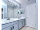 Bathroom with double vanity and updated fixtures at 5103 Ashcrest Ct, Tampa, FL 33647