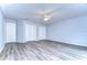 Bright bedroom with ceiling fan and wood-look flooring at 5103 Ashcrest Ct, Tampa, FL 33647