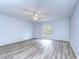 Large bedroom featuring wood-look floors and a window at 5103 Ashcrest Ct, Tampa, FL 33647