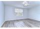 Bright bedroom with ceiling fan and large window at 5103 Ashcrest Ct, Tampa, FL 33647