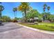 Brick community entrance with gated access and landscaping at 5103 Ashcrest Ct, Tampa, FL 33647