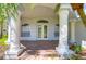 Front entrance with double doors and brick columns at 5103 Ashcrest Ct, Tampa, FL 33647