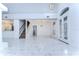 Bright and spacious foyer with marble flooring and double doors at 5103 Ashcrest Ct, Tampa, FL 33647