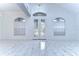 Bright and spacious foyer with marble flooring and double doors at 5103 Ashcrest Ct, Tampa, FL 33647