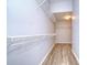 Spacious walk-in closet with wire shelving and hanging rods at 5103 Ashcrest Ct, Tampa, FL 33647