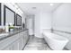 Elegant bathroom featuring a soaking tub and double vanity at 5200 Lagos Ct, New Port Richey, FL 34655