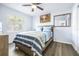 Cozy bedroom with wood flooring and a ceiling fan at 5200 Lagos Ct, New Port Richey, FL 34655