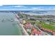 Aerial view showcasing waterfront property, golf course, and marina at 6051 Sun Blvd # 504, St Petersburg, FL 33715