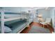 Cozy bedroom featuring a bunk bed and sitting area at 6051 Sun Blvd # 504, St Petersburg, FL 33715