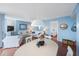 Bright dining area with white table and chairs, open to living room at 6051 Sun Blvd # 504, St Petersburg, FL 33715