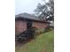 Brick house side view with landscaping at 6549 Brentwood Dr, Zephyrhills, FL 33542