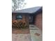 Brick house with gray roof and landscaping at 6549 Brentwood Dr, Zephyrhills, FL 33542