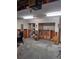 Interior view of a damaged garage, showing water damage and exposed framing at 6549 Brentwood Dr, Zephyrhills, FL 33542