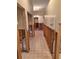 Hallway with damaged walls and floor at 6549 Brentwood Dr, Zephyrhills, FL 33542