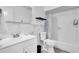 Clean bathroom with white vanity, marble tile, and updated fixtures at 6706 S Kissimmee St, Tampa, FL 33616