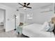 Well-lit bedroom with queen bed, ceiling fan, and ample closet space at 6706 S Kissimmee St, Tampa, FL 33616