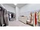 Large walk-in closet with ample shelving and hanging space at 7532 Ashbrooke Pine Loop, Odessa, FL 33556