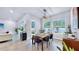 Bright dining room with wooden table and bench seating near the kitchen at 7532 Ashbrooke Pine Loop, Odessa, FL 33556