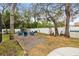 Relaxing backyard with fire pit, seating, and storage shed at 8535 Delaware Dr, Weeki Wachee, FL 34607