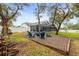 Fire pit and seating area in a backyard with trees at 8535 Delaware Dr, Weeki Wachee, FL 34607