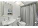 Clean bathroom with white sink, toilet, and shower at 8535 Delaware Dr, Weeki Wachee, FL 34607