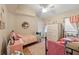 Charming bedroom with twin beds, a dresser, and a ceiling fan at 8535 Delaware Dr, Weeki Wachee, FL 34607