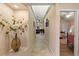 Long hallway with tile flooring offering views of the living room and a bedroom at 8535 Delaware Dr, Weeki Wachee, FL 34607