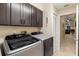 Bright laundry room with Samsung washer and dryer, and cabinets at 8535 Delaware Dr, Weeki Wachee, FL 34607