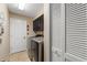 Laundry room with washer, dryer, and ample cabinet storage at 8535 Delaware Dr, Weeki Wachee, FL 34607