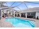 Inviting, refreshing pool with a covered patio at 8535 Delaware Dr, Weeki Wachee, FL 34607