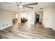 Open living room with views into kitchen and entryway at 8615 Greenfield Ln, Zephyrhills, FL 33541