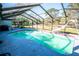 Spacious screened pool with a slide and backyard view at 8615 Greenfield Ln, Zephyrhills, FL 33541