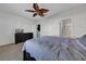 Bright bedroom with ceiling fan and ensuite bathroom access at 8967 Indigo Trail Loop, Riverview, FL 33578