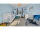 Bright Bedroom with crib, changing table, and ample space at 8967 Indigo Trail Loop, Riverview, FL 33578