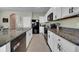 Modern kitchen with white cabinets and granite countertops at 8967 Indigo Trail Loop, Riverview, FL 33578