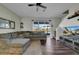 Spacious living room with L-shaped sofa and wood floors at 8967 Indigo Trail Loop, Riverview, FL 33578