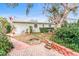 Brick path to fire pit in backyard at 911 16Th Nw Ave, Largo, FL 33770