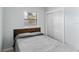 Simple bedroom with a double bed and built-in closet at 911 16Th Nw Ave, Largo, FL 33770