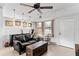 Relaxing living room with a sofa and ceiling fan at 911 16Th Nw Ave, Largo, FL 33770