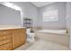 Bathroom features a large garden tub and a separate shower at 9715 Taylor Rose Ln # 9715, Seminole, FL 33777