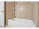 Clean bathroom with a bathtub and tile surround at 9715 Taylor Rose Ln # 9715, Seminole, FL 33777