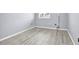 Light and airy bedroom with wood-look floors at 9715 Taylor Rose Ln # 9715, Seminole, FL 33777