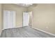 Bright bedroom featuring wood-look floors and double closet at 9715 Taylor Rose Ln # 9715, Seminole, FL 33777