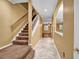 Staircase and hallway view from the entry at 9715 Taylor Rose Ln # 9715, Seminole, FL 33777