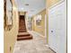 Interior view of entryway with staircase and view to living room at 9715 Taylor Rose Ln # 9715, Seminole, FL 33777