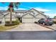 Front view of townhome with driveway and parking at 9715 Taylor Rose Ln # 9715, Seminole, FL 33777