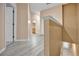 Upstairs hallway with light gray laminate floors at 9715 Taylor Rose Ln # 9715, Seminole, FL 33777